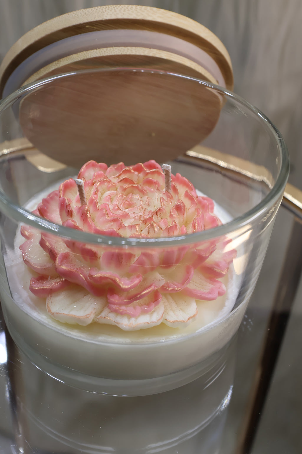 Luxury handcrafted champagne bloom rose candle with layered wax petals in a glass jar