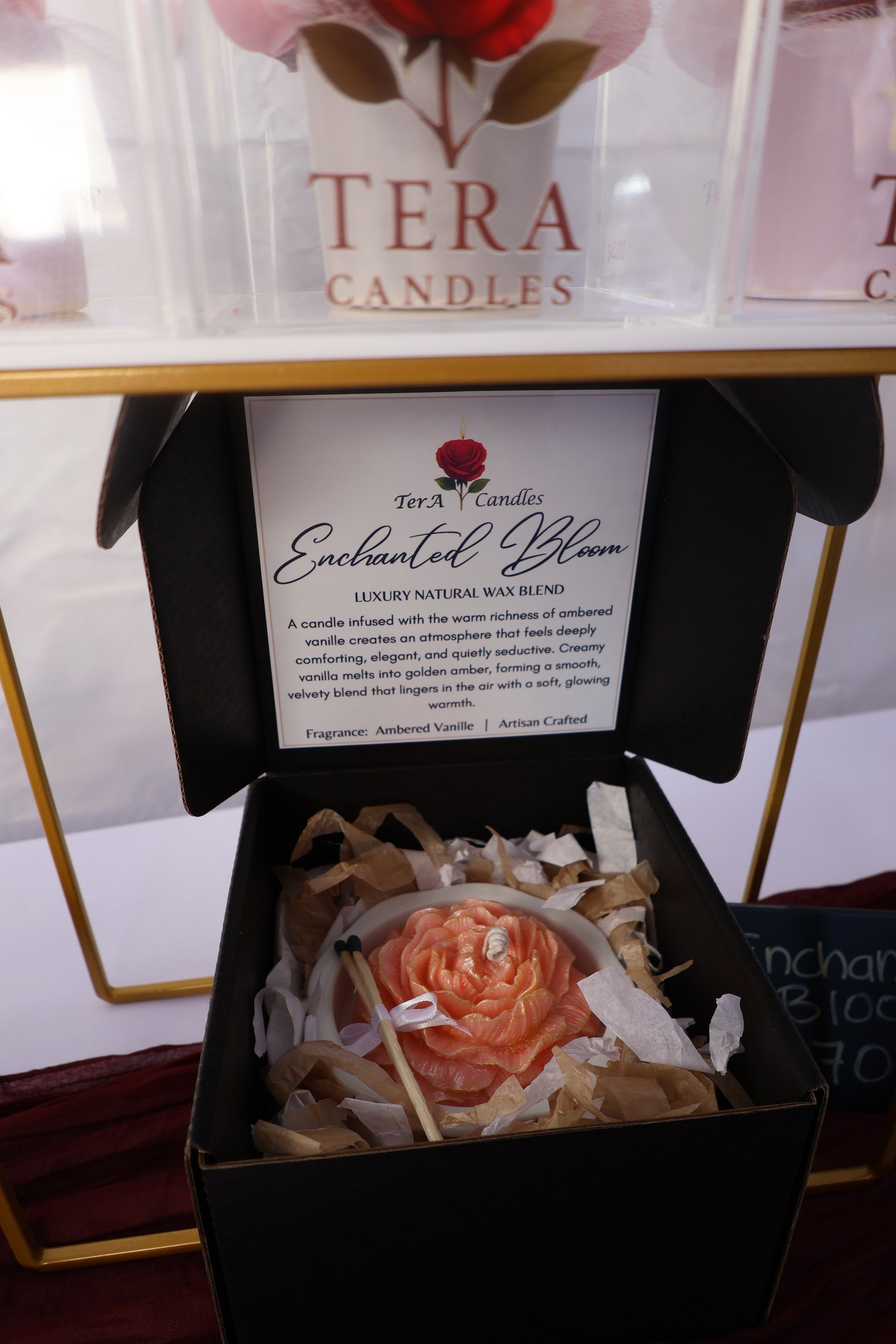 Elegant black luxury gift box opened to reveal handcrafted floral candle artistry by TerA Candles, featuring premium presentation packaging and signature branded card for an elevated gifting experience.