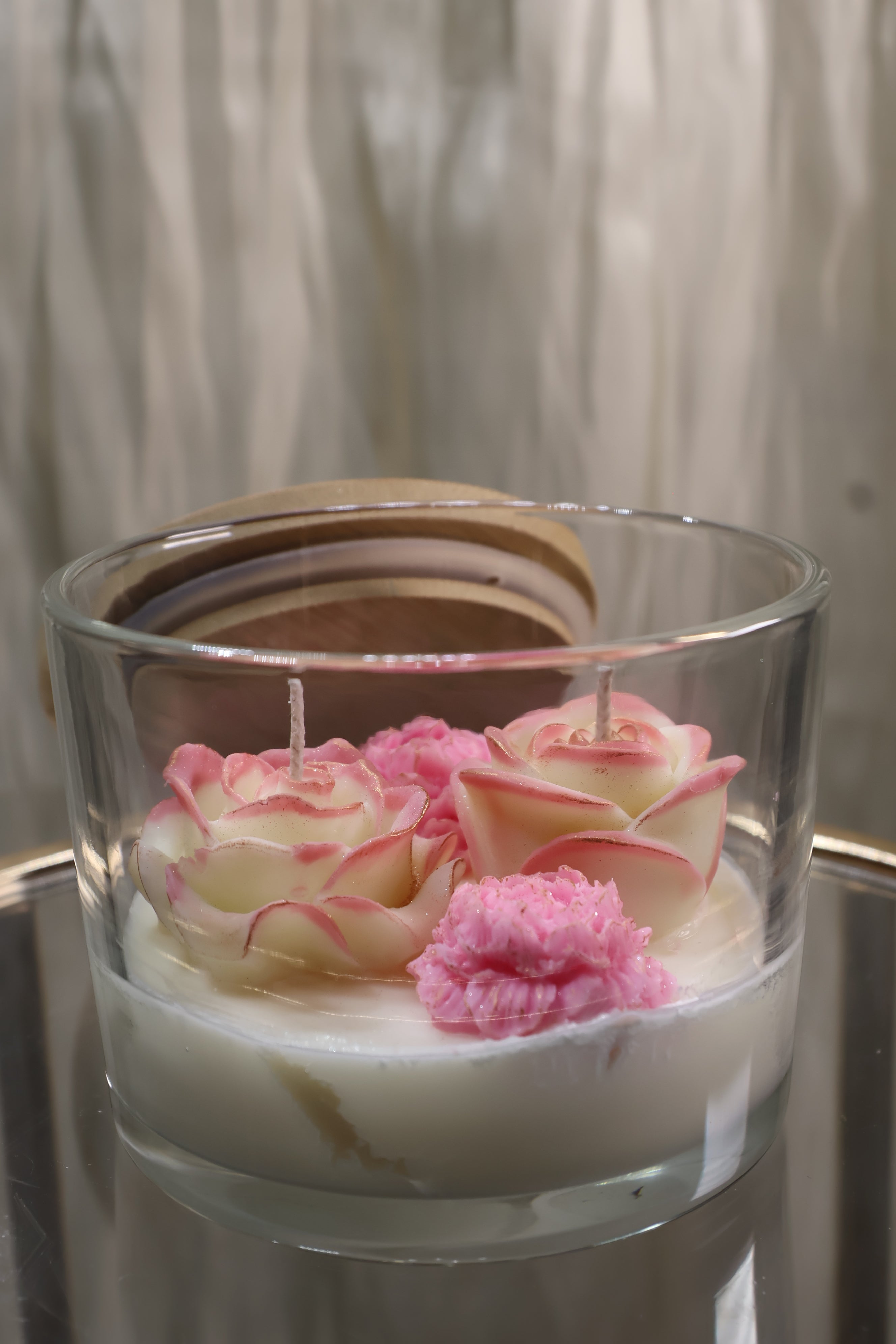 Handcrafted quartet of love rose candle with four sculpted wax flowers in a glass jar