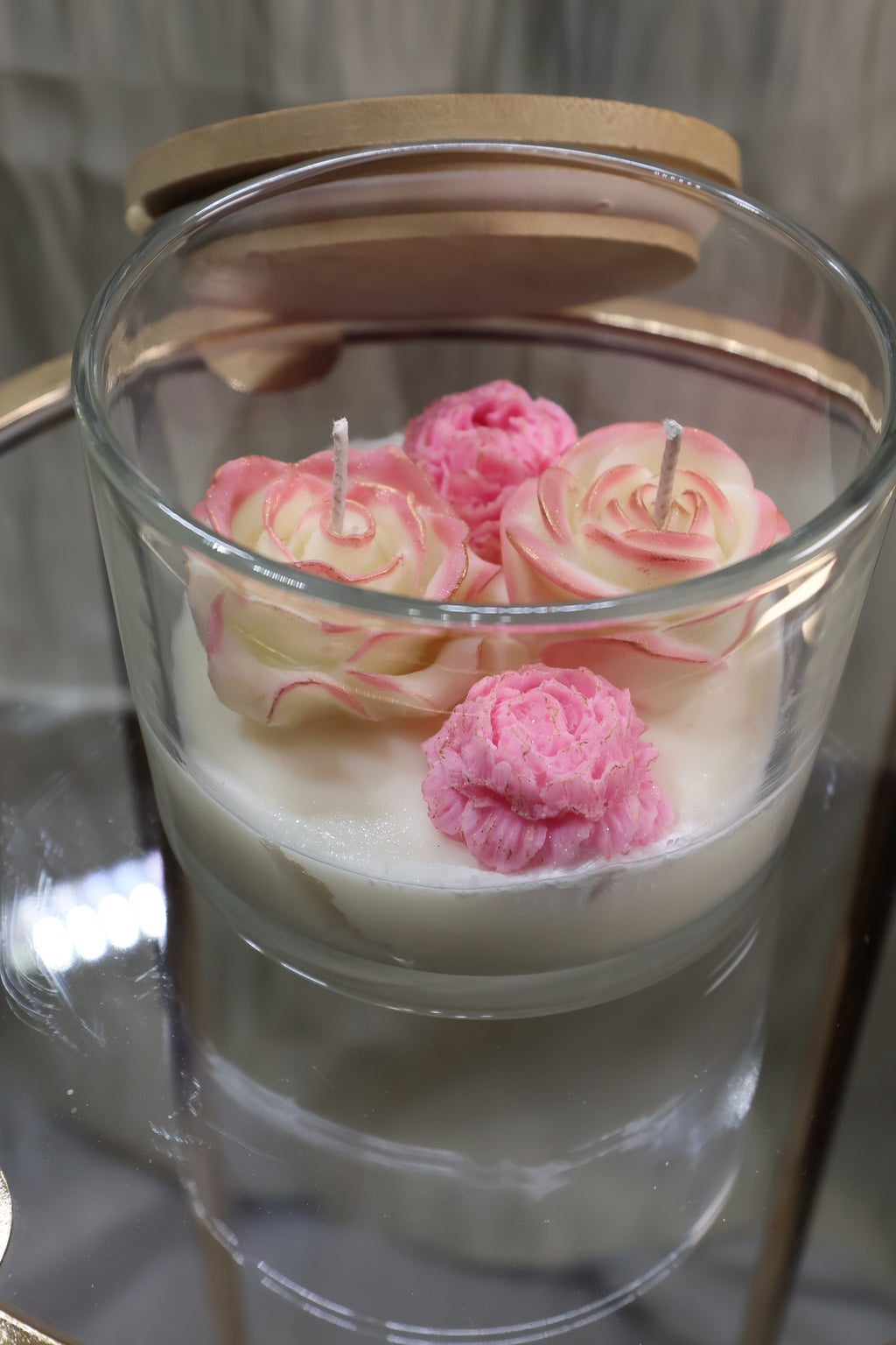 Handcrafted quartet of love rose candle with four sculpted wax flowers in a glass jar