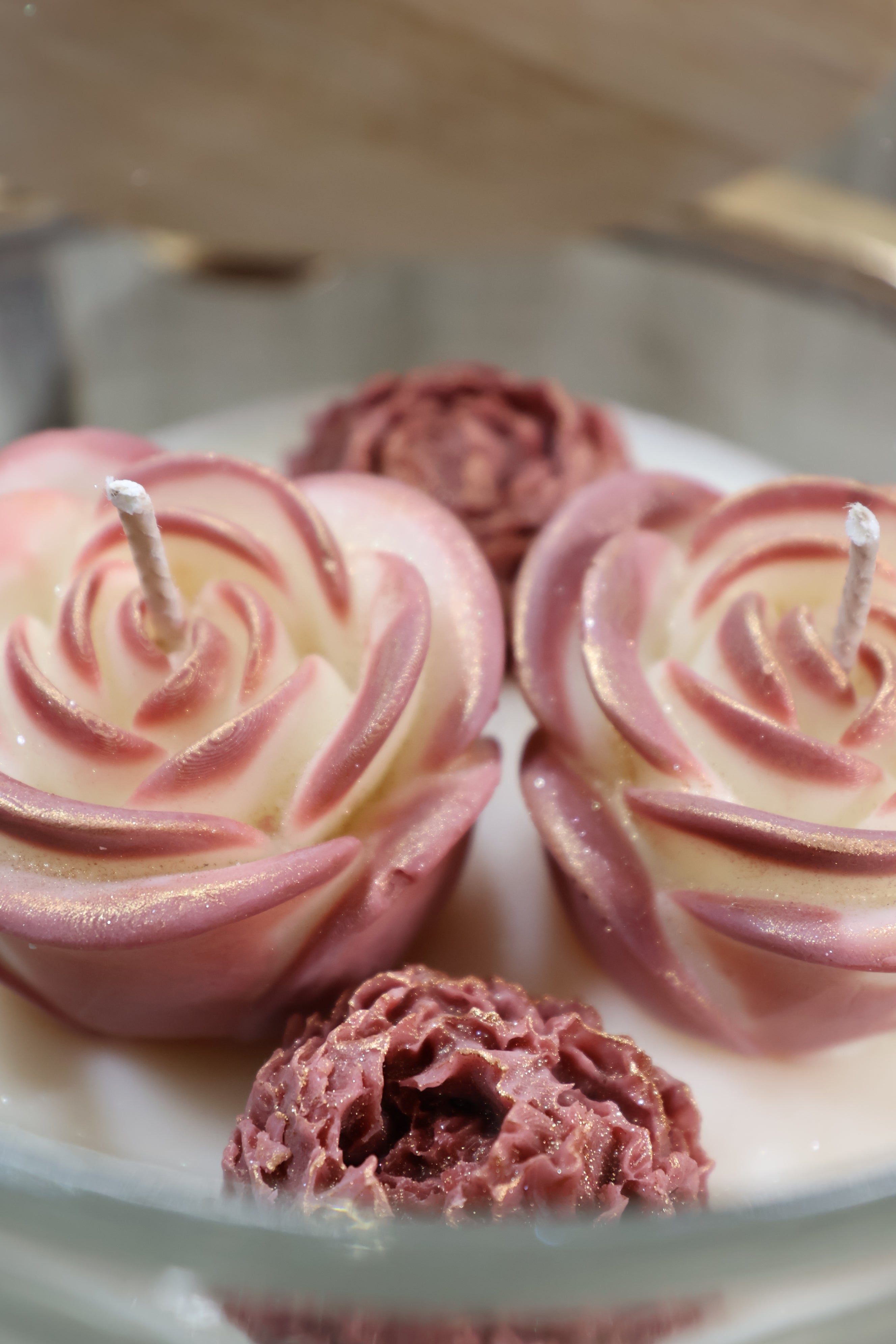 Handcrafted rosé duet rose candle with two sculpted wax flowers in a glass jar