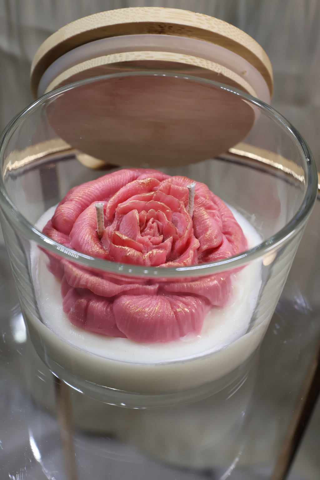 Handcrafted velvet blush rose candle with sculpted wax petals in a glass jar