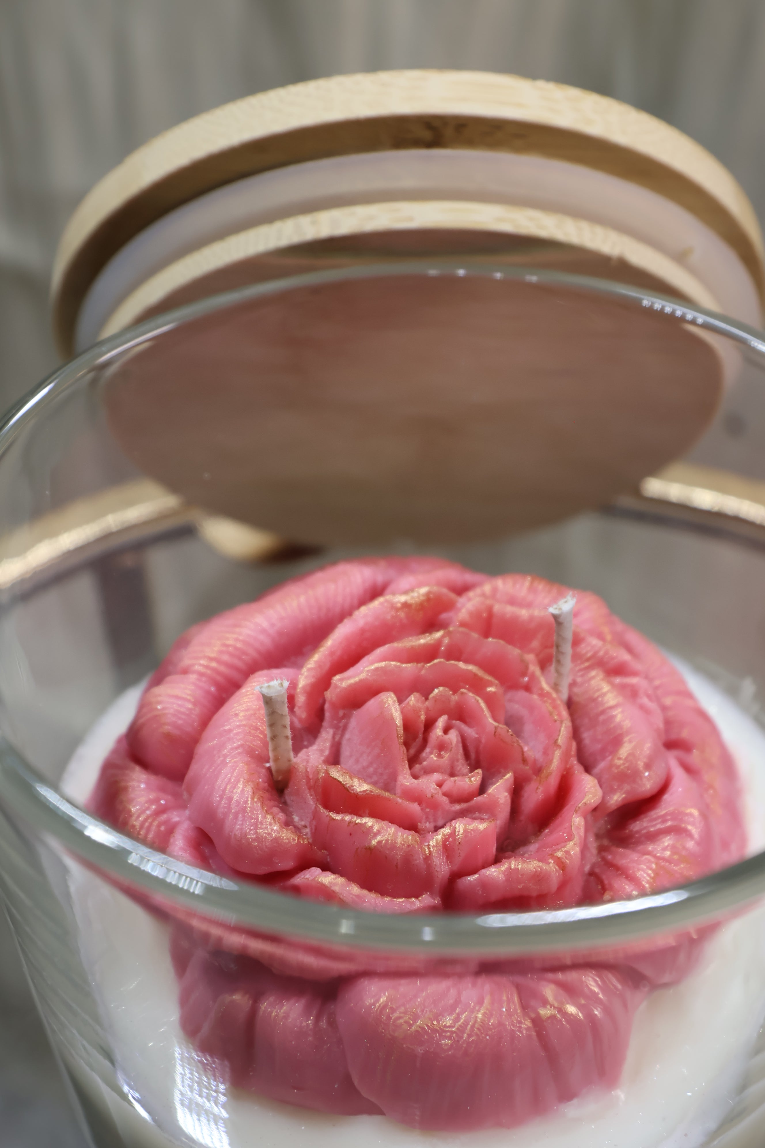 Handcrafted velvet blush rose candle with sculpted wax petals in a glass jar